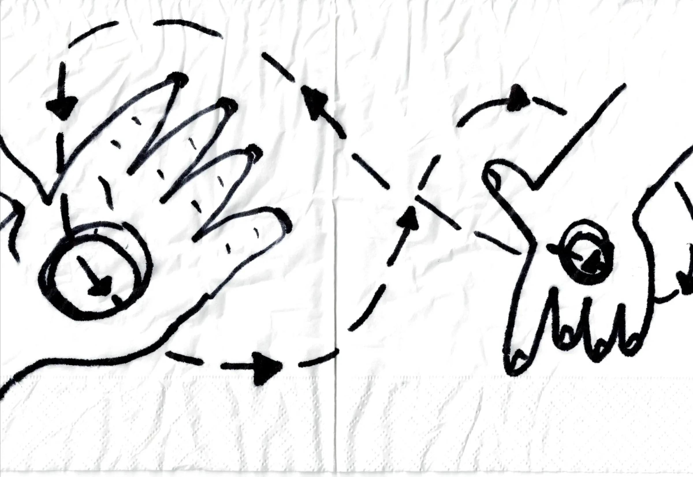 Marker drawing of two hands with arrows on a paper napkin